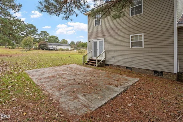 a backyard of a house with lots of green space