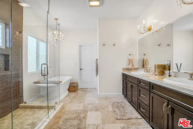 a bathroom with a bathtub and shower