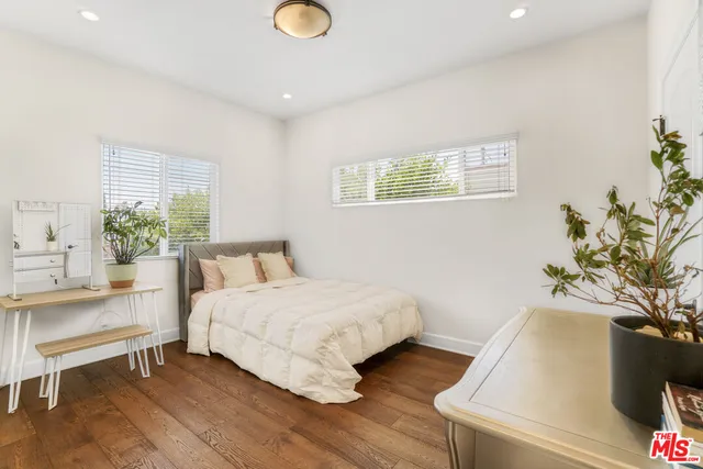 a en suite bathroom with a tub sink and mirror