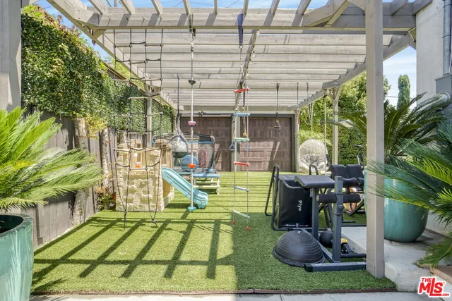 a view of a backyard with sitting area
