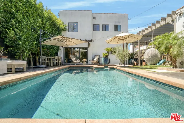 a kitchen with a stove and a wooden cabinets