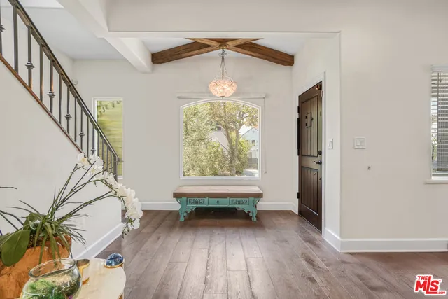a view of entryway with wooden floor