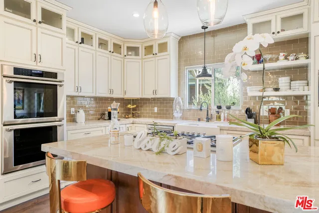 a kitchen with a wooden floor and white appliances
