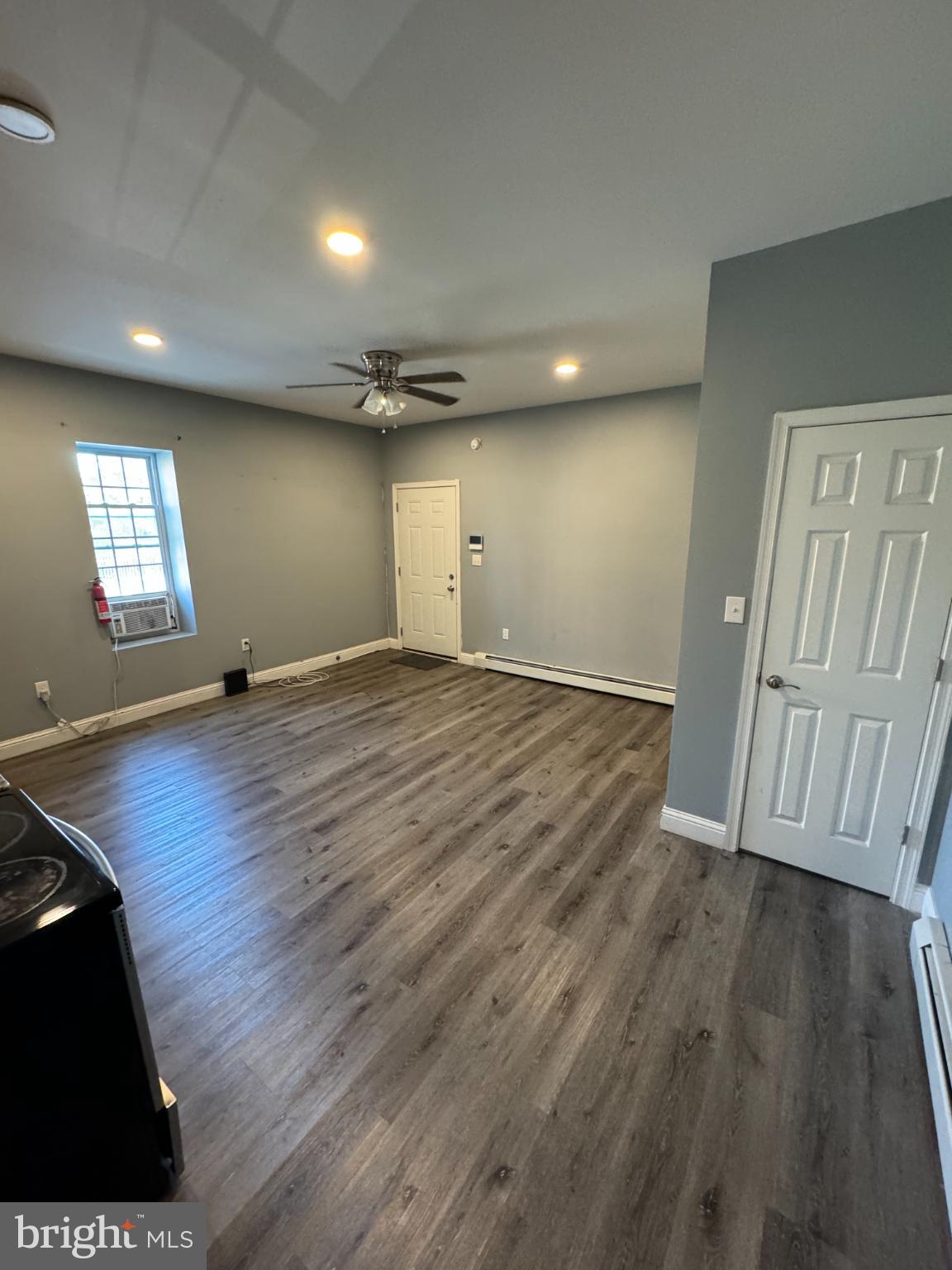 Spacious, modern living area with natural light.