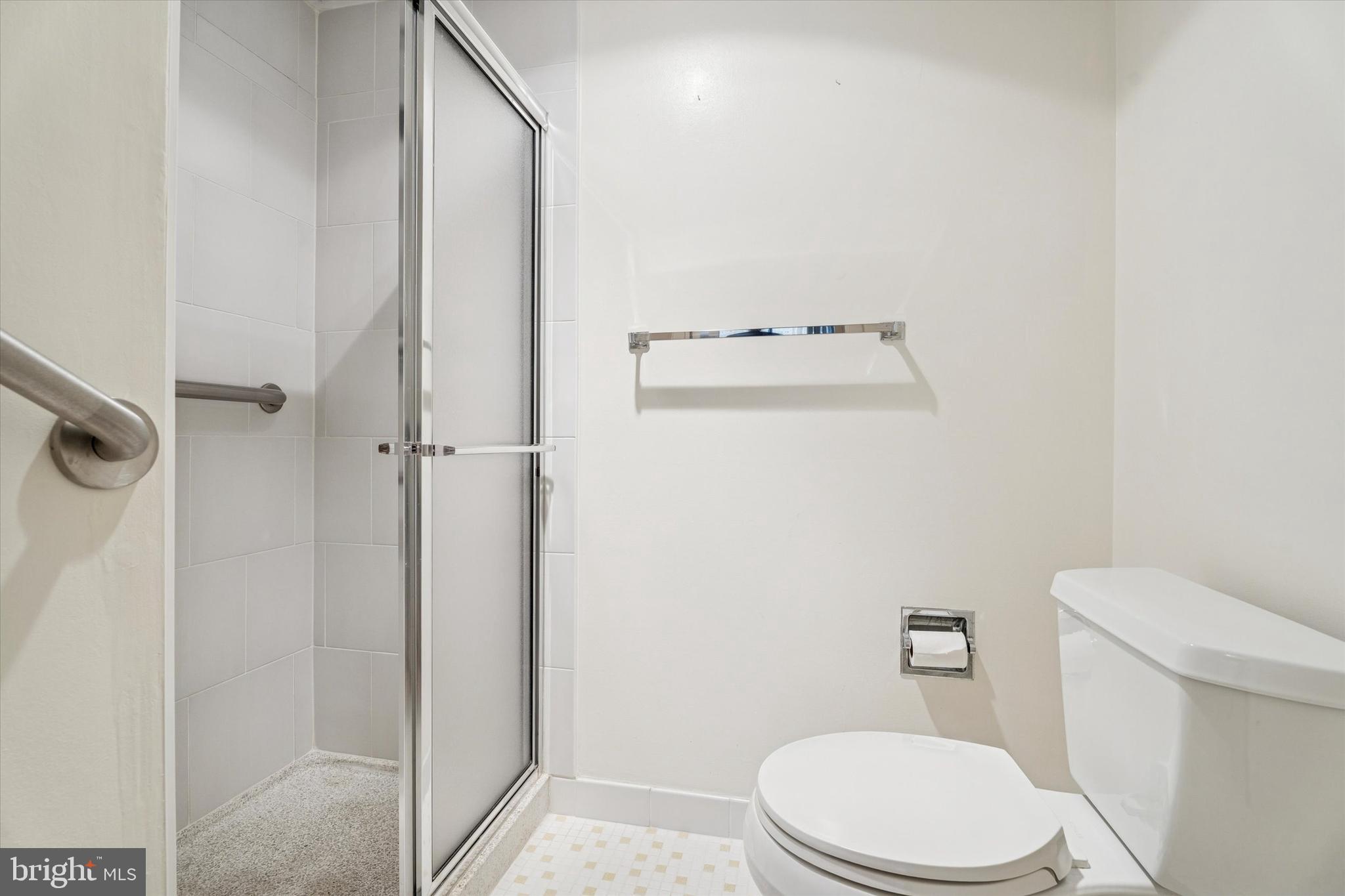 100 West Avenue, Unit 329S Jenkintown, PA 19046 - Photo 11 of 19 a white toilet sitting next to a bathroom sink