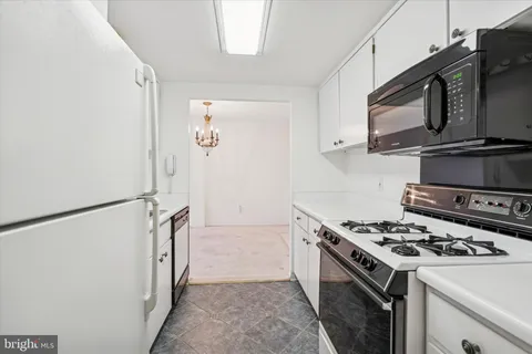 a kitchen with a stove and a microwave