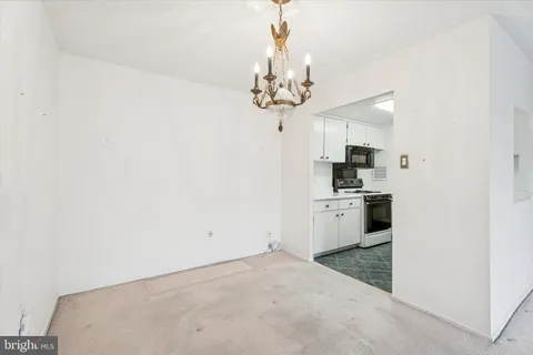 a view of a kitchen with a sink and dishwasher