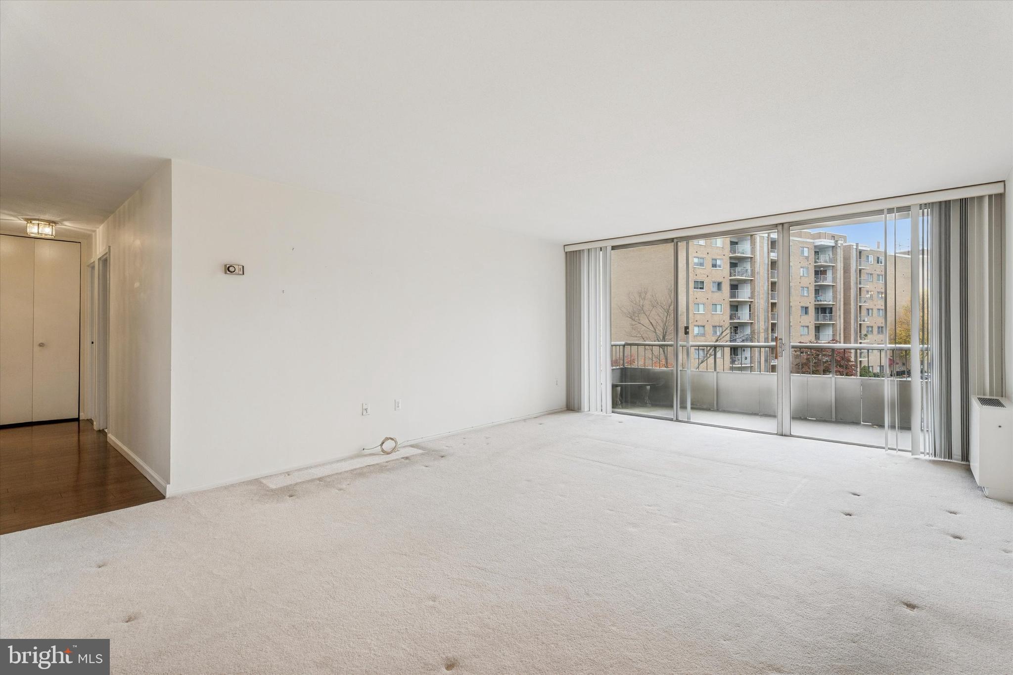 100 West Avenue, Unit 329S Jenkintown, PA 19046 - Photo 6 of 19 a view of an empty room with a sliding door