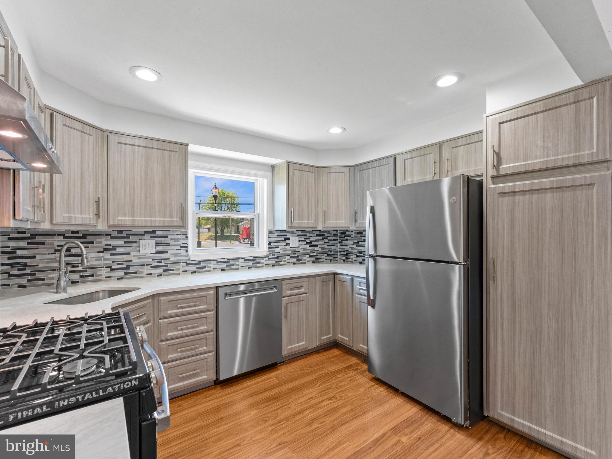 157 West Browning Road Bellmawr, NJ 08031 - Photo 11 of 41 a kitchen with stainless steel appliances granite countertop a refrigerator stove and sink