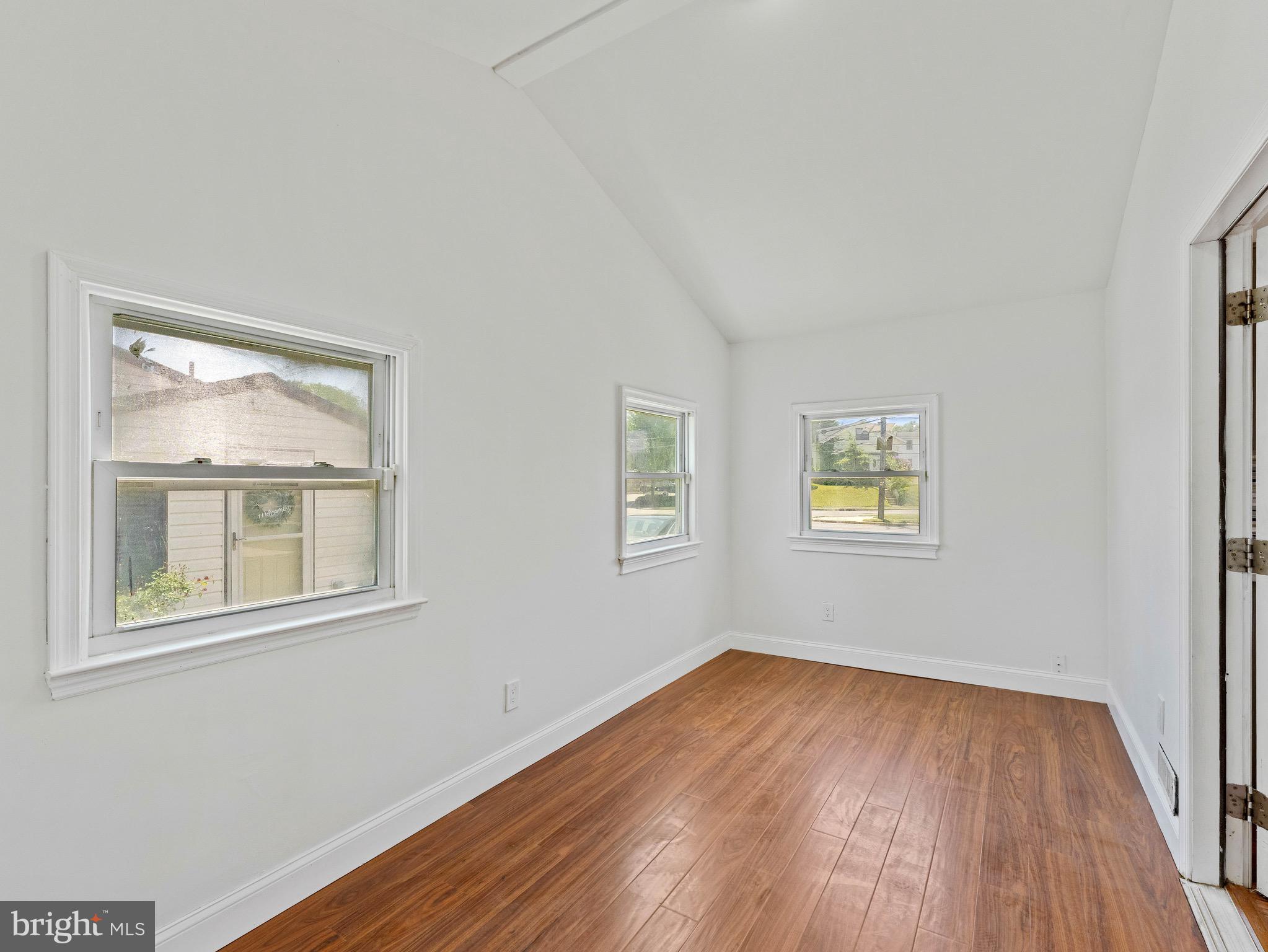 157 West Browning Road Bellmawr, NJ 08031 - Photo 14 of 41 an empty room with a window and wooden floor