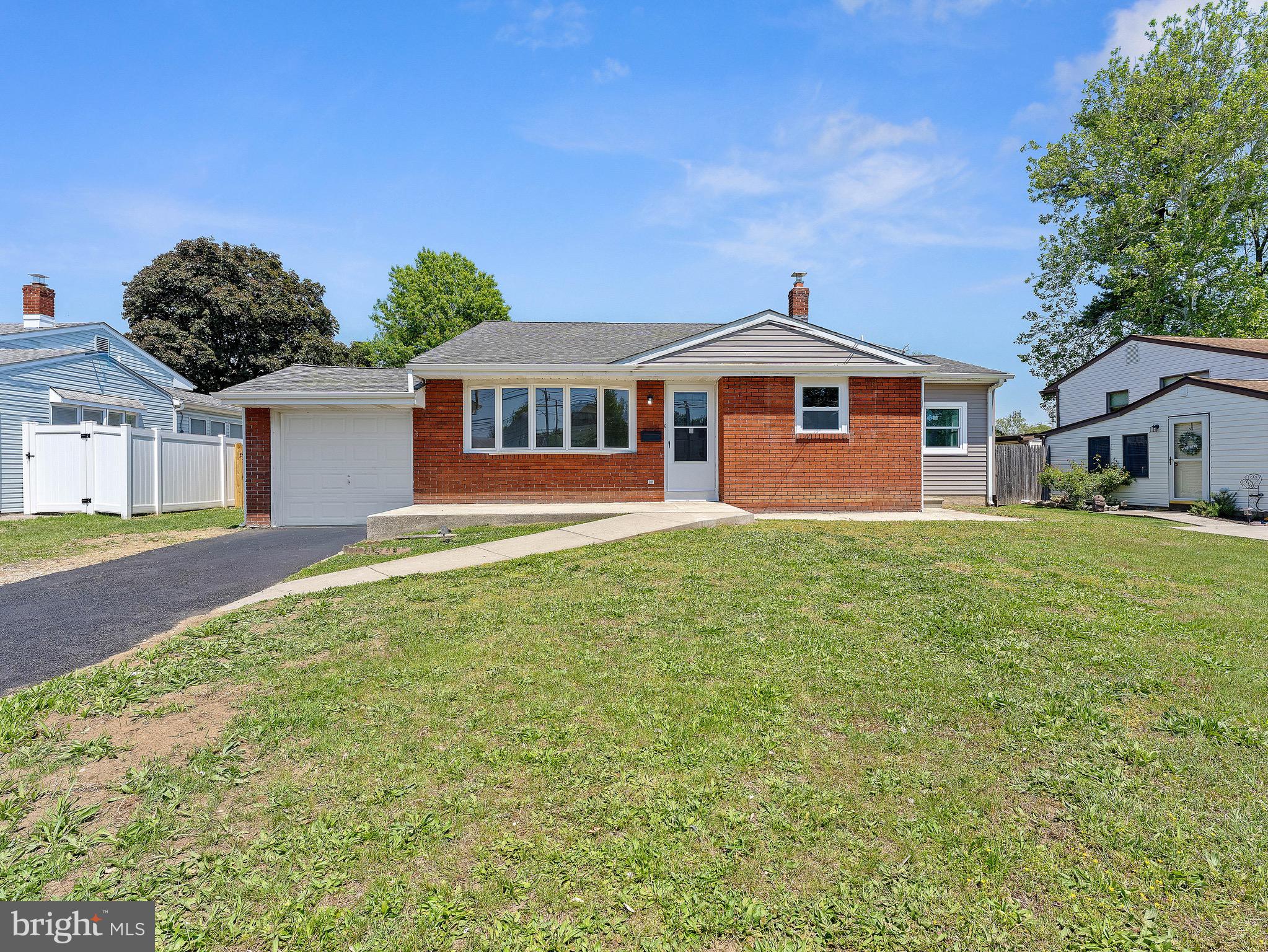 157 West Browning Road Bellmawr, NJ 08031 - Photo 2 of 41 a front view of a house with a garden and trees