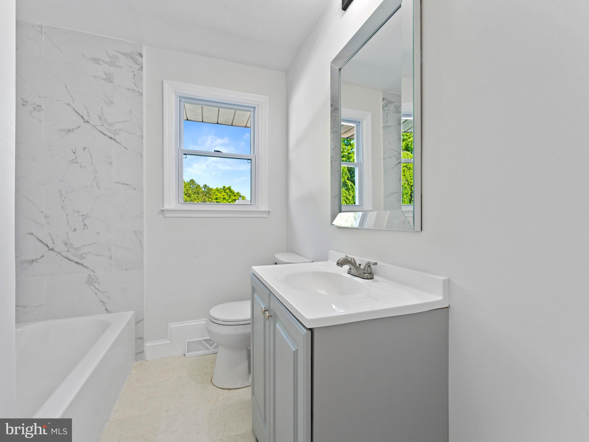 157 West Browning Road Bellmawr, NJ 08031 - Photo 22 of 41 a bathroom with a sink a toilet and a bathtub