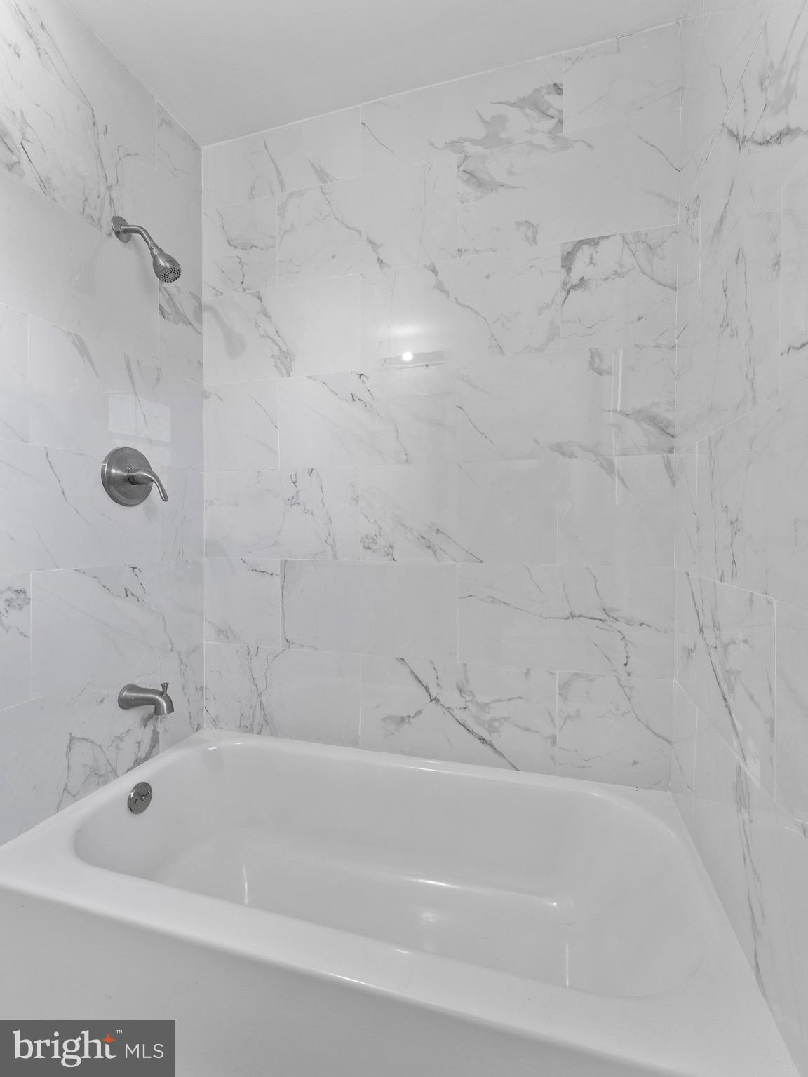 157 West Browning Road Bellmawr, NJ 08031 - Photo 23 of 41 a bathroom with a shower and a bath tub