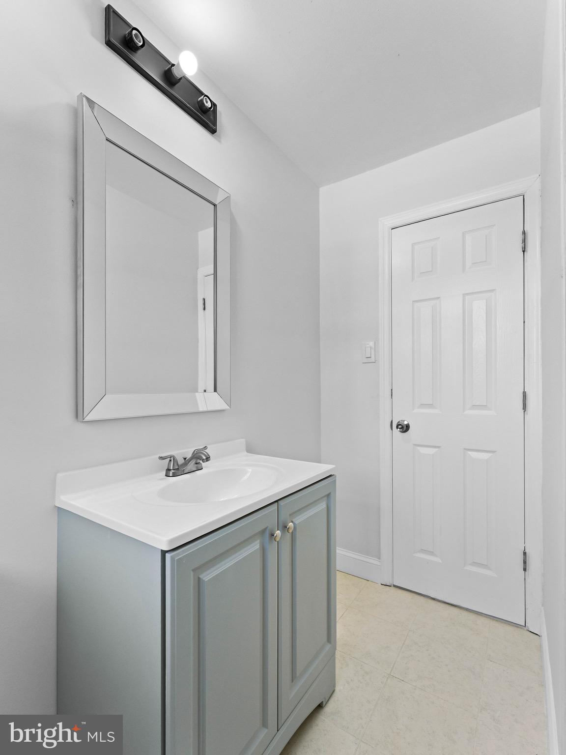 157 West Browning Road Bellmawr, NJ 08031 - Photo 24 of 41 a bathroom with a sink vanity and a mirror