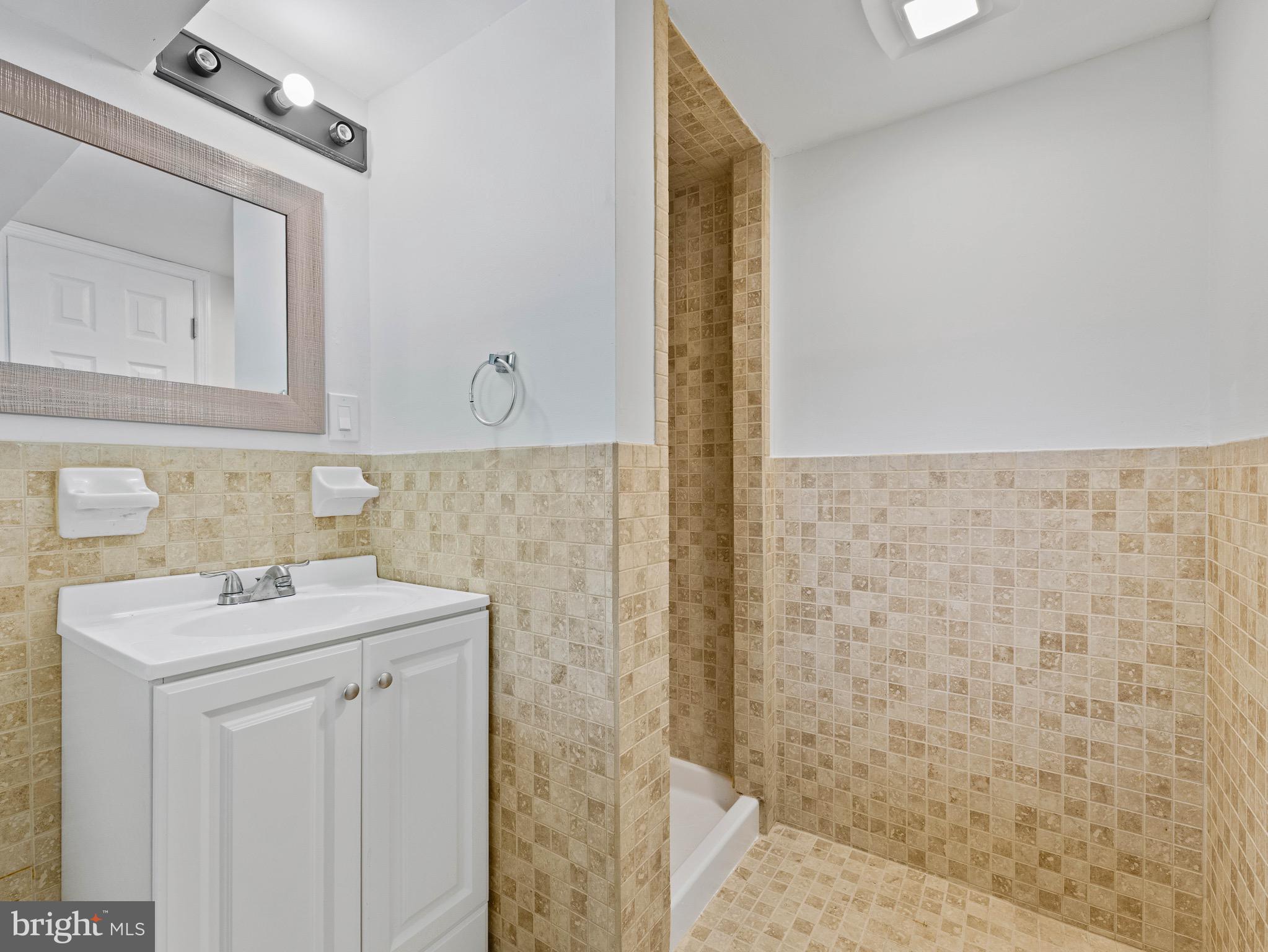157 West Browning Road Bellmawr, NJ 08031 - Photo 29 of 41 a utility room with a sink a vanity and a mirror