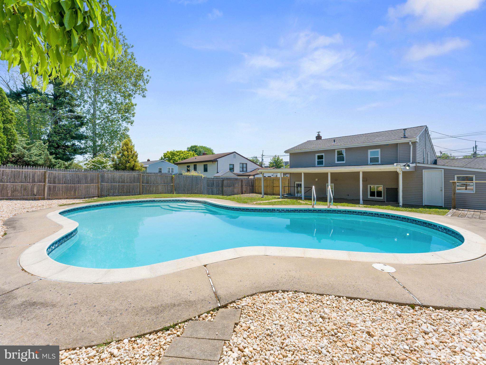157 West Browning Road Bellmawr, NJ 08031 - Photo 38 of 41 a view of swimming pool with a yard and fence