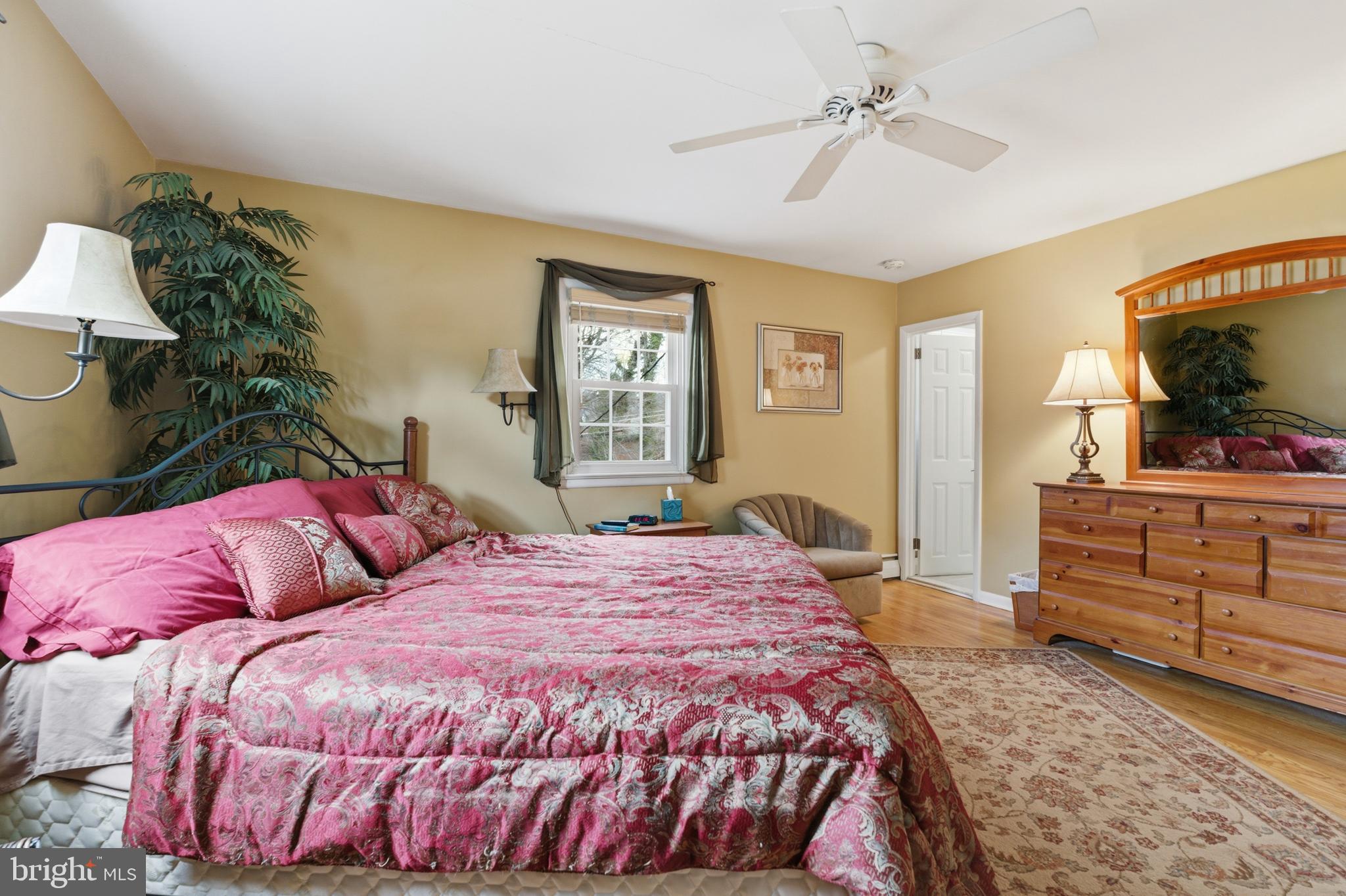 720 Evans Road Springfield, PA 19064 - Photo 16 of 38 a bedroom with a bed and a flat screen tv in it