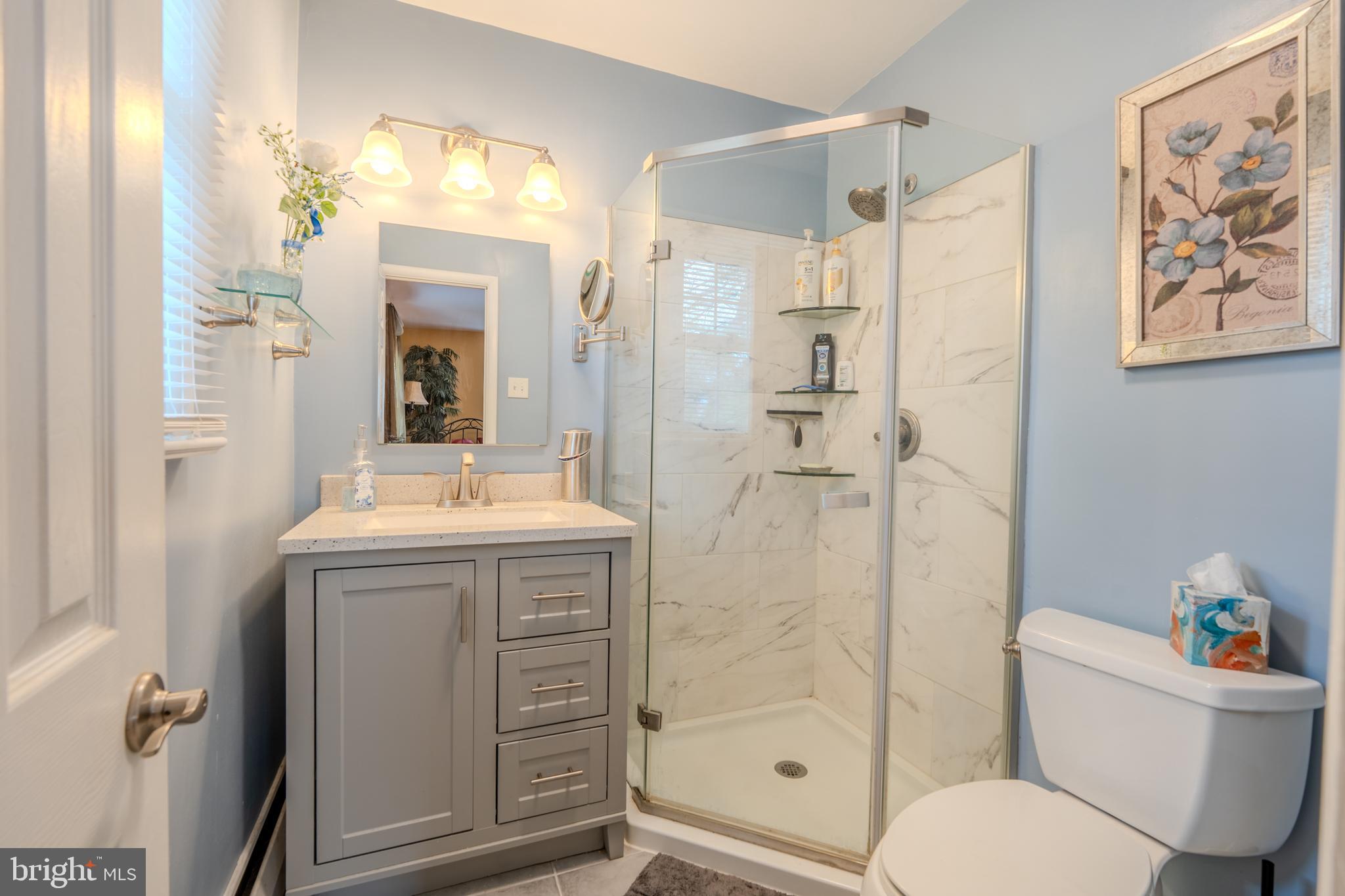 720 Evans Road Springfield, PA 19064 - Photo 17 of 38 a bathroom with a sink toilet and shower