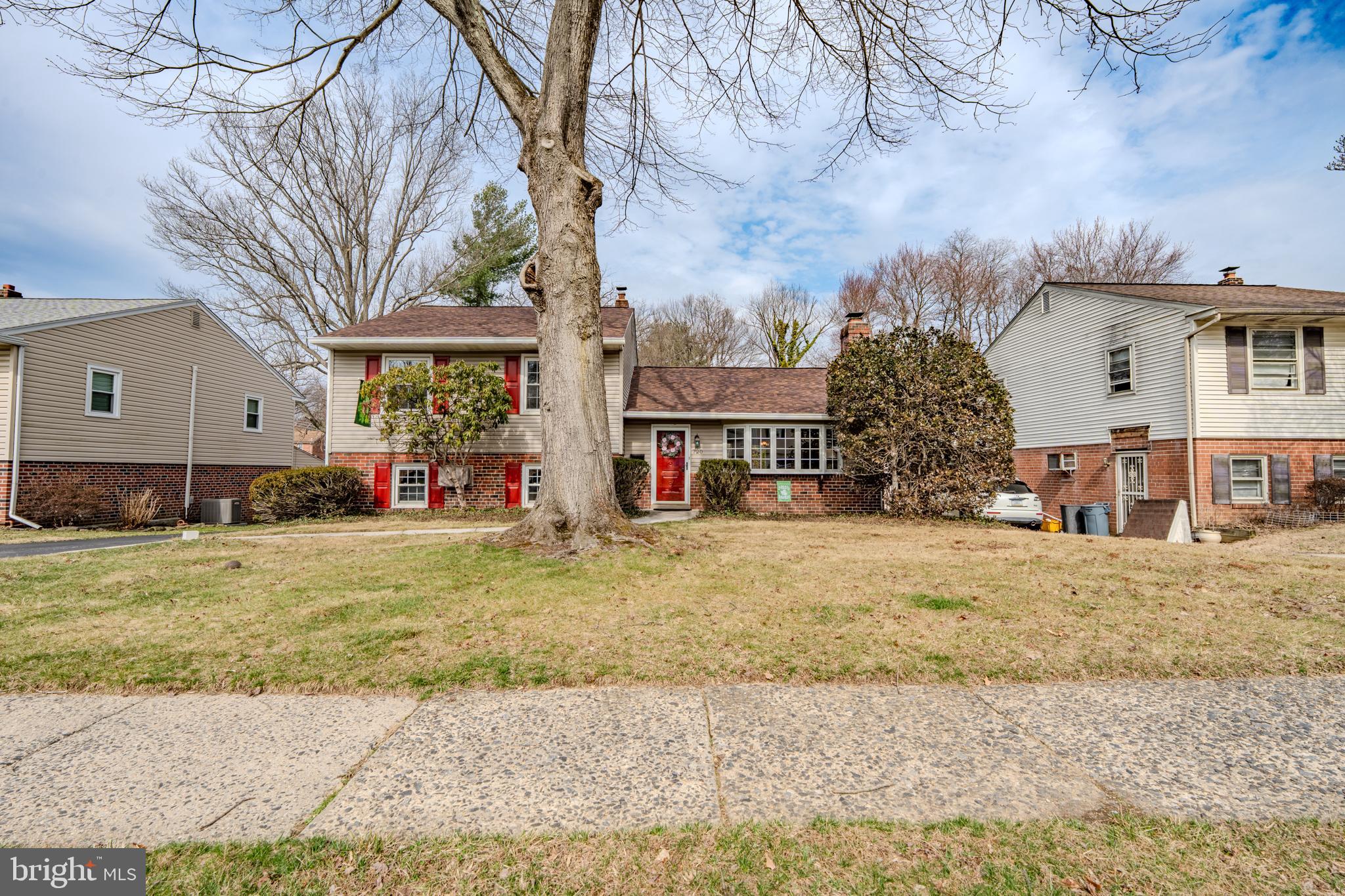 720 Evans Road Springfield, PA 19064 - Photo 2 of 38 a backyard of a house with lots of green space and fountain