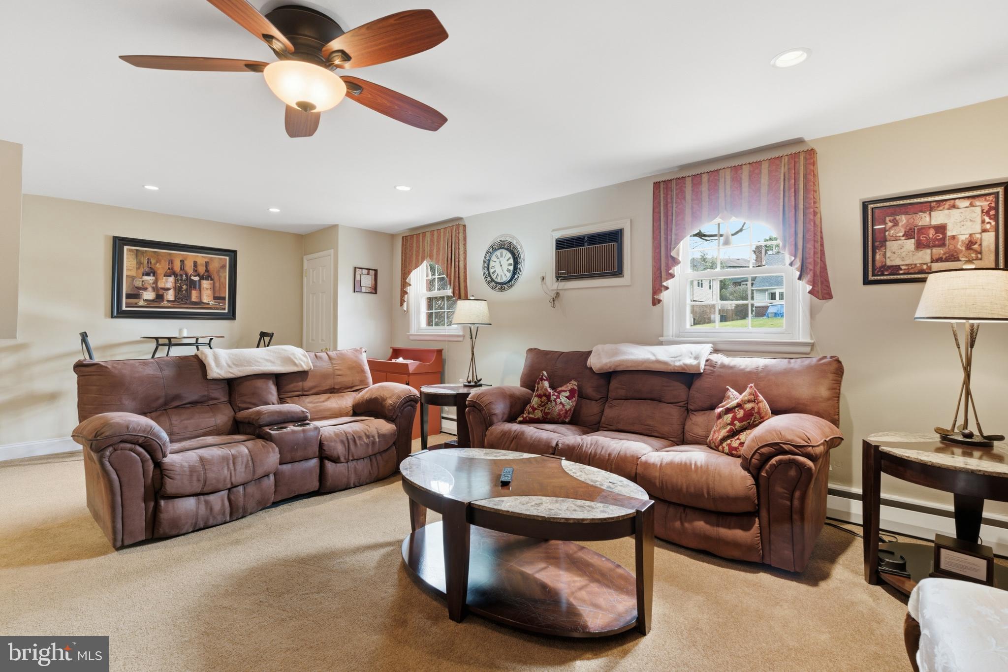 720 Evans Road Springfield, PA 19064 - Photo 23 of 38 a living room with furniture and a large window