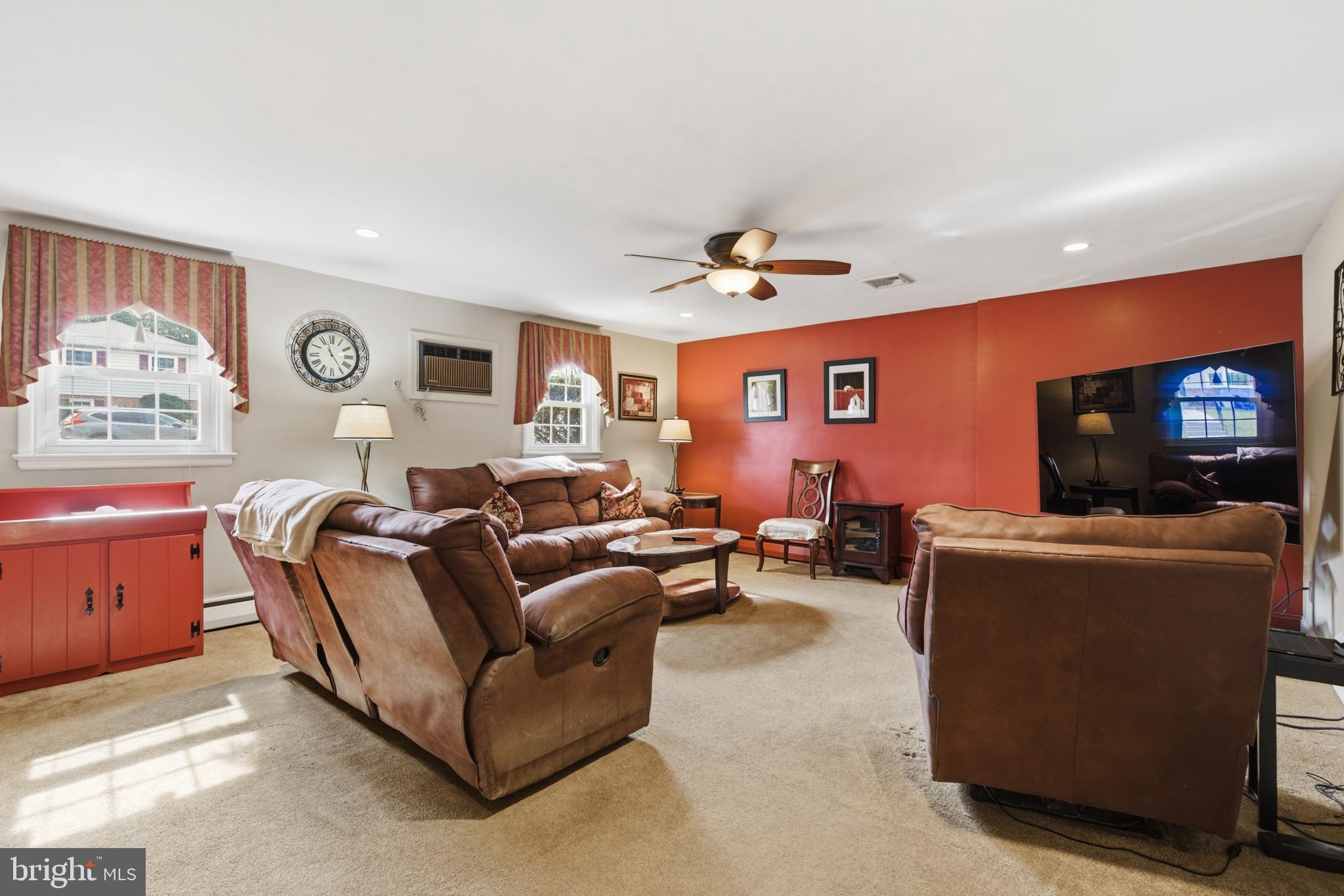 720 Evans Road Springfield, PA 19064 - Photo 25 of 38 a living room with furniture and a flat screen tv