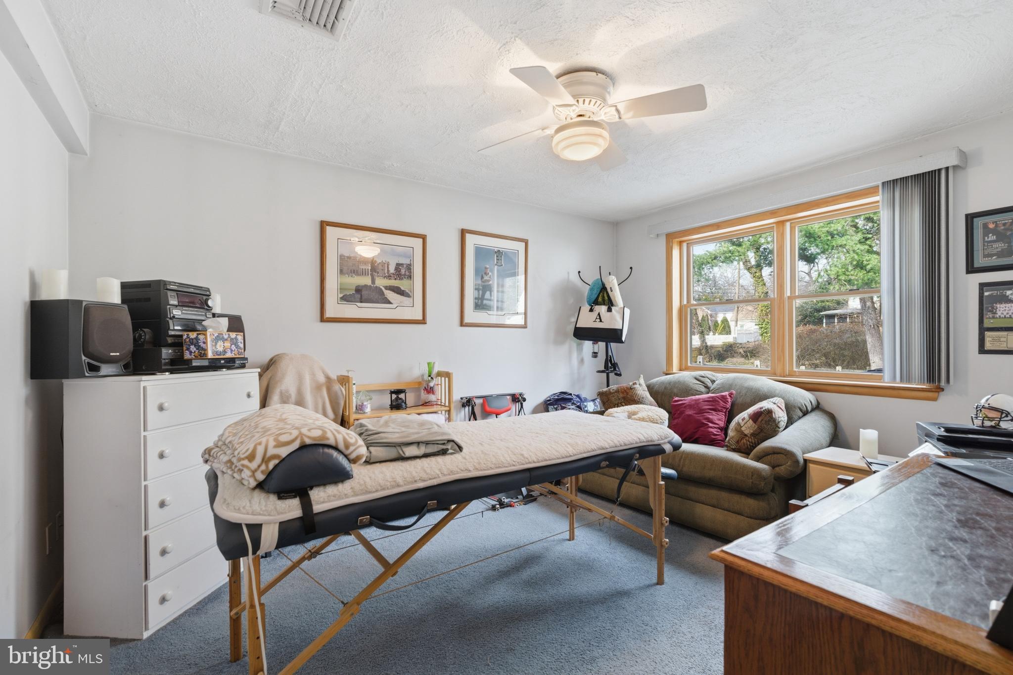 720 Evans Road Springfield, PA 19064 - Photo 27 of 38 a living room with furniture and large windows