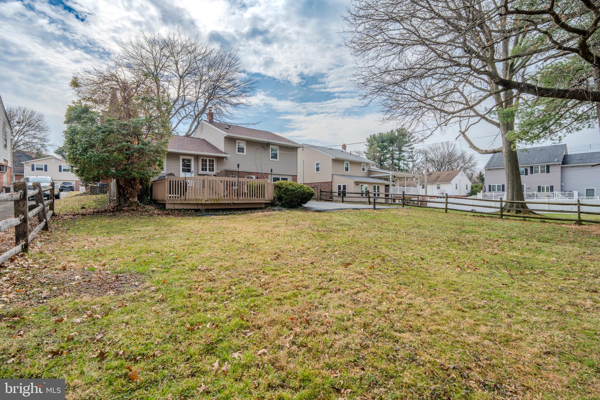 720 Evans Road Springfield, PA 19064 - Photo 32 of 38 a view of a house with a yard and large trees