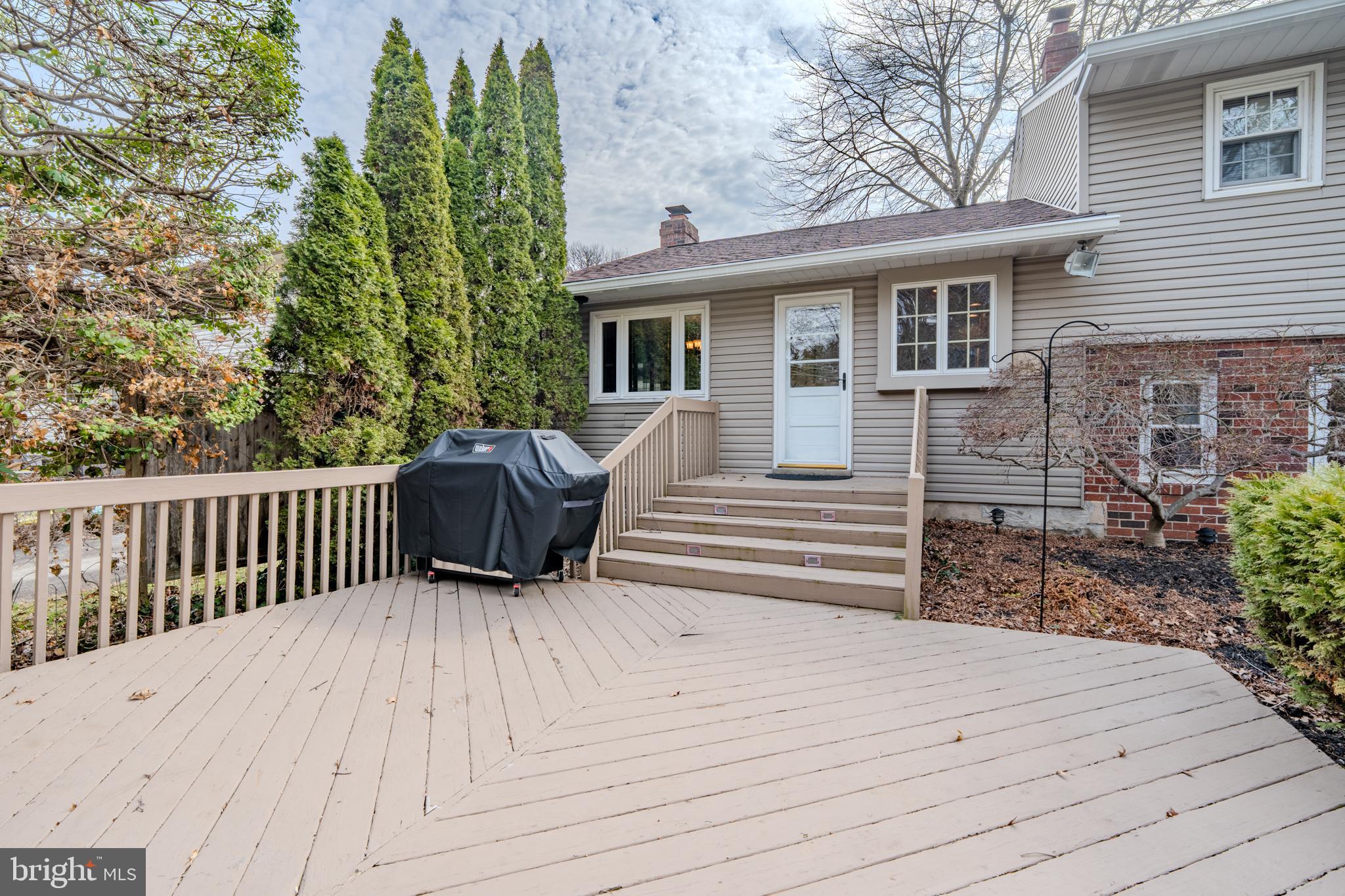 720 Evans Road Springfield, PA 19064 - Photo 33 of 38 a view of a wooden deck and a yard