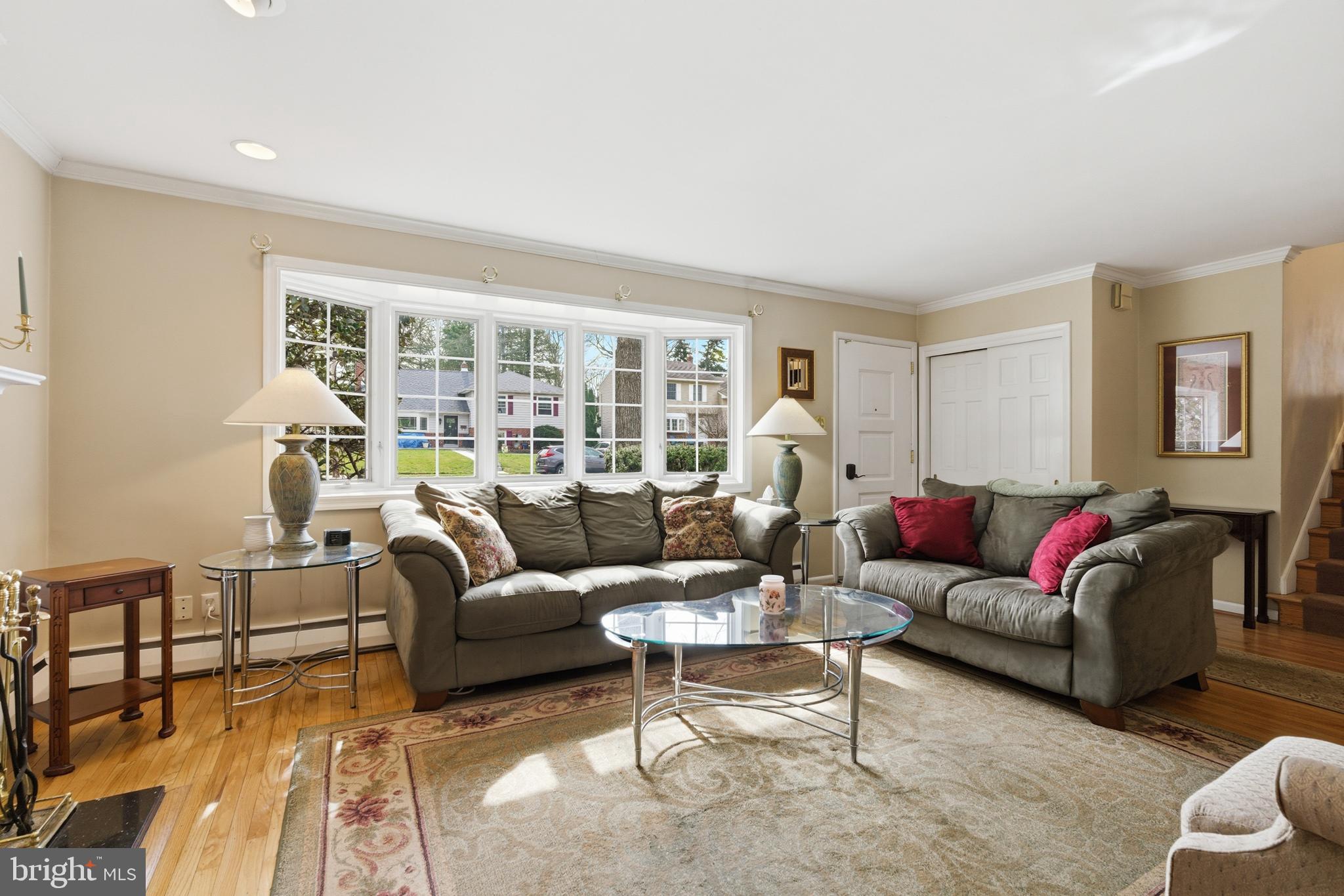 720 Evans Road Springfield, PA 19064 - Photo 5 of 38 a living room with furniture and a large window