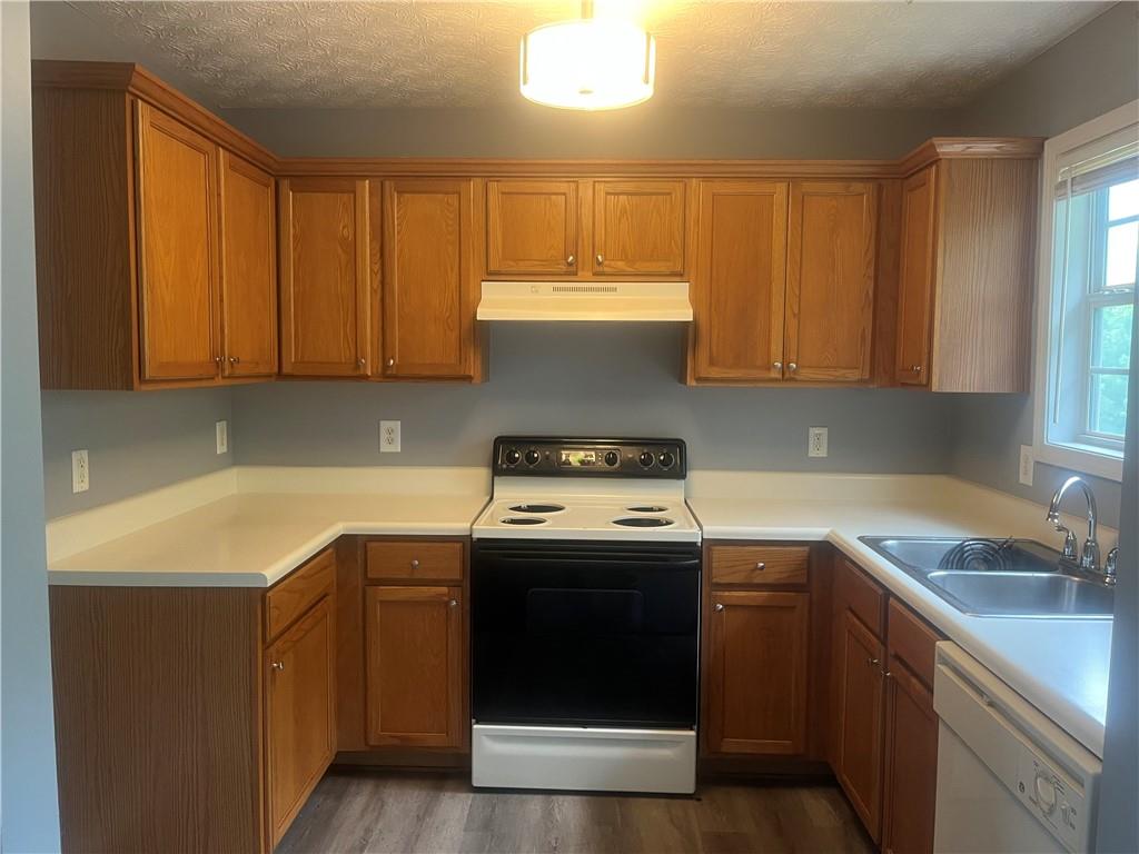 4170 Jewel Terrace Conley, GA 30288 - Photo 11 of 28 a kitchen with a sink stove and cabinets