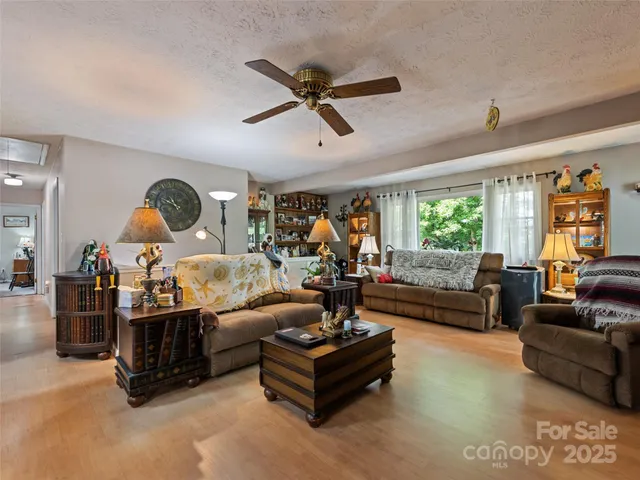 a living room with furniture gym equipment and a window