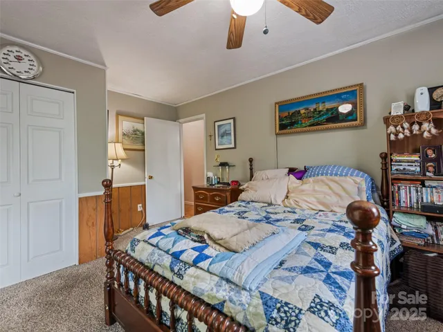 a bed room with a bed and a dresser