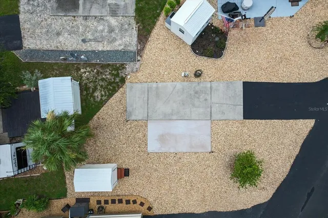an aerial view of a house with a swimming pool