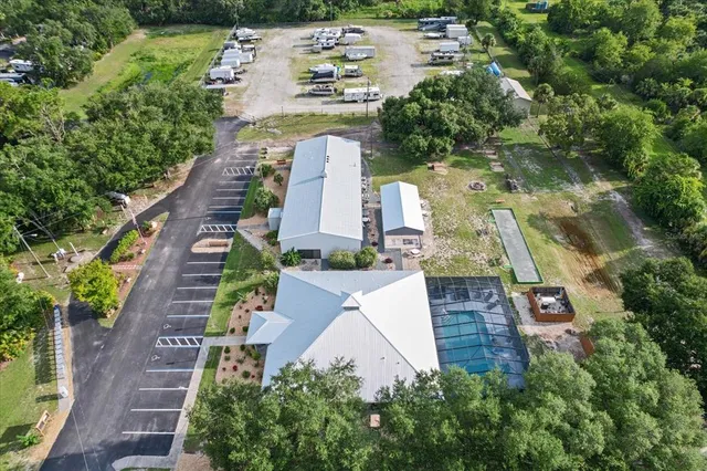 an aerial view of a house with outdoor space