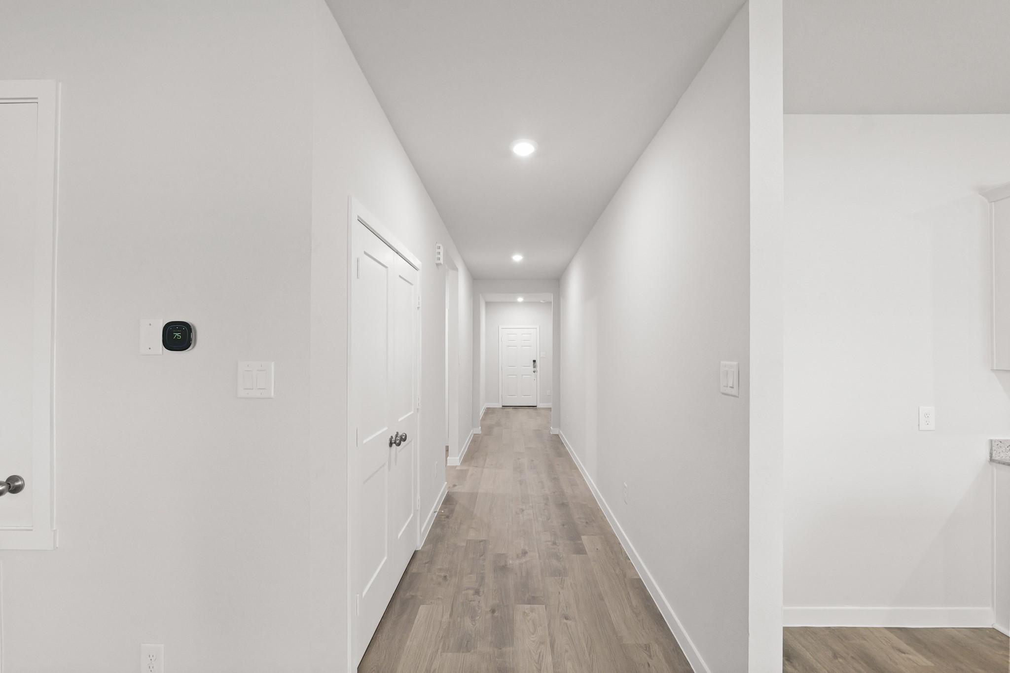 469 Shoreview Drive Conroe, TX 77303 - Photo 14 of 41 a view of a hallway with wooden floor and a bathroom