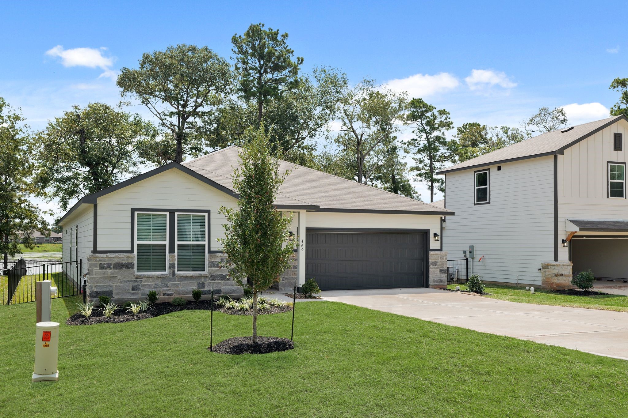 469 Shoreview Drive Conroe, TX 77303 - Photo 2 of 41 a backyard of a house with table and chairs