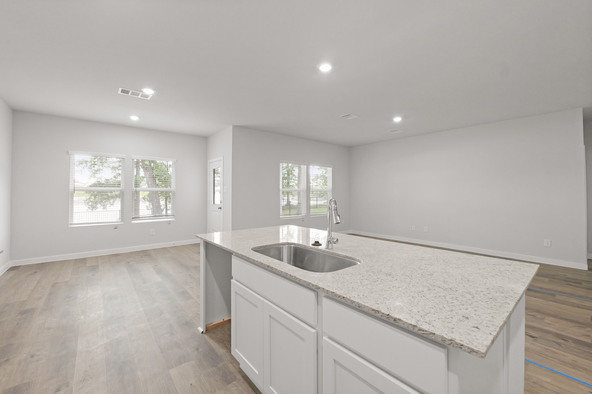 469 Shoreview Drive Conroe, TX 77303 - Photo 21 of 41 a kitchen with a sink and chandelier