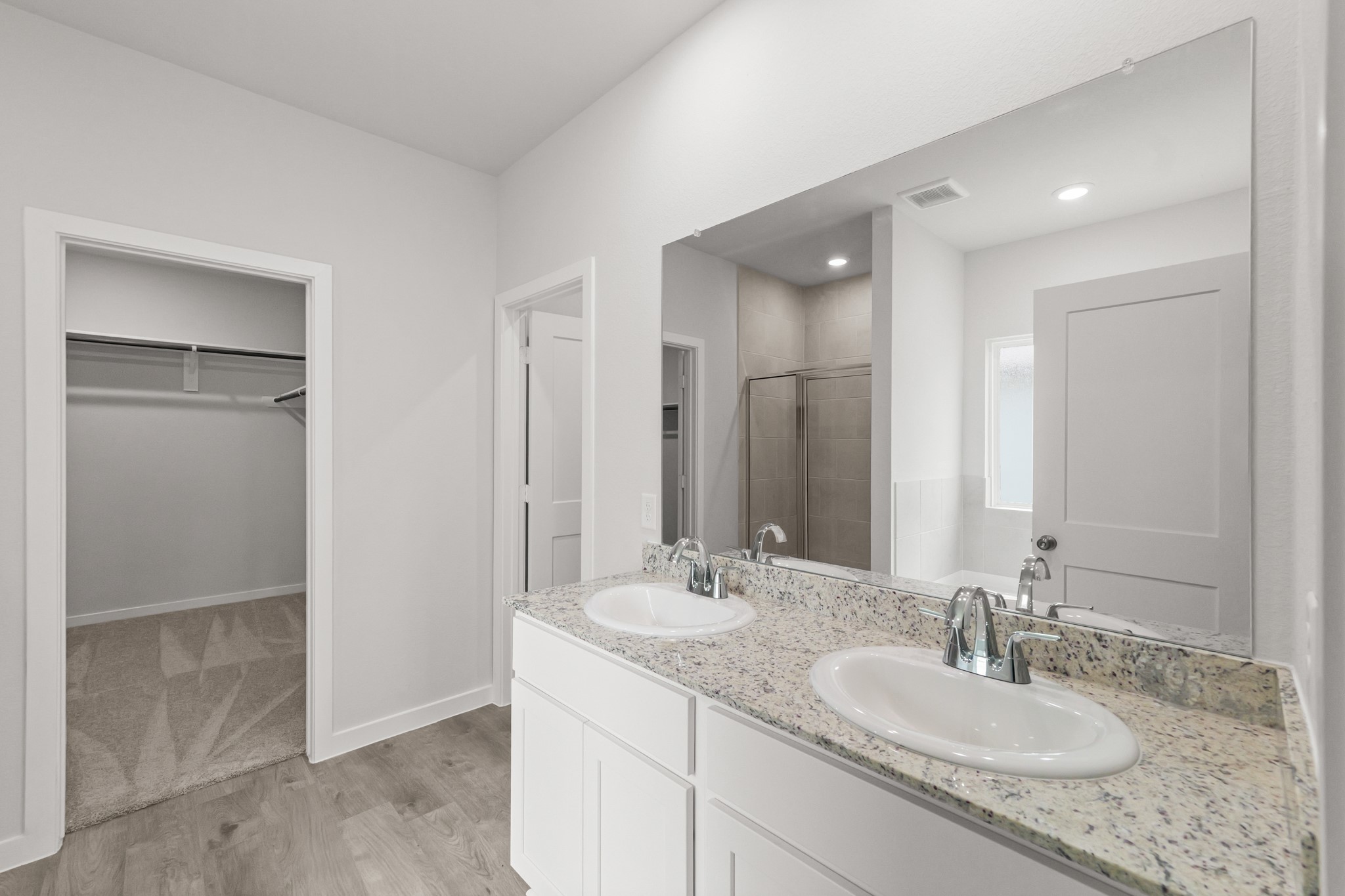 469 Shoreview Drive Conroe, TX 77303 - Photo 27 of 41 a bathroom with a granite countertop sink and a mirror