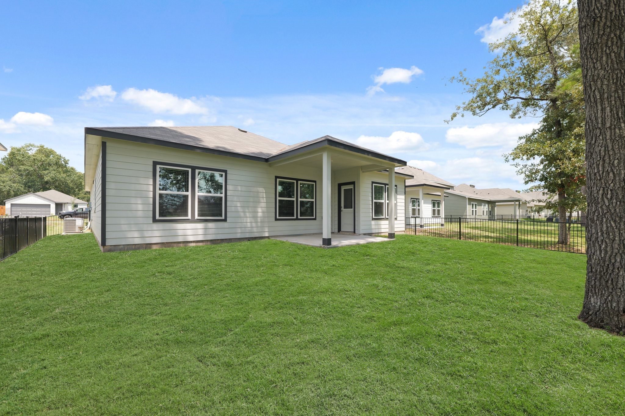 469 Shoreview Drive Conroe, TX 77303 - Photo 32 of 41 a view of a house with backyard and garden