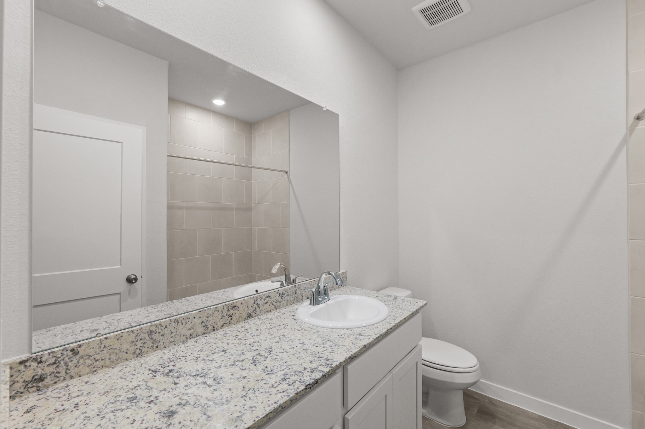 469 Shoreview Drive Conroe, TX 77303 - Photo 7 of 41 a bathroom with a granite countertop sink and a mirror