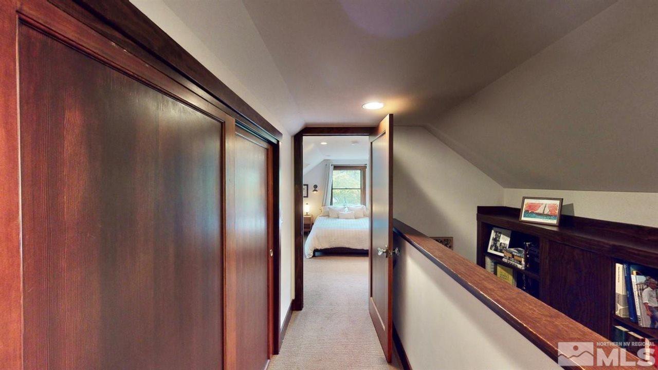 1300 Clough Road Reno, NV 89509 - Photo 20 of 40 a view of a hallway to a livingroom with furniture