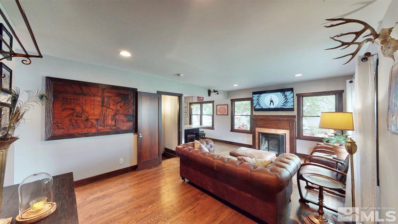 1300 Clough Road Reno, NV 89509 - Photo 2 of 40 a living room with furniture a window and a flat screen tv