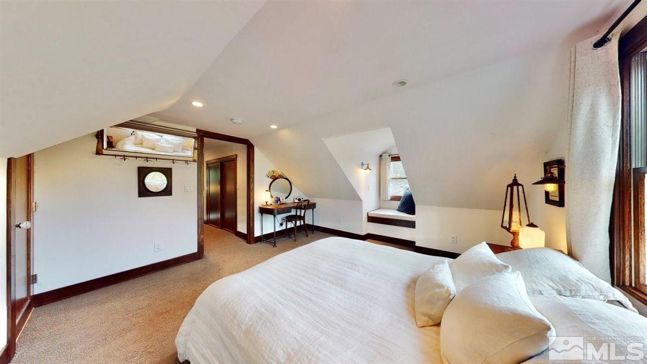 1300 Clough Road Reno, NV 89509 - Photo 22 of 40 a bed room with a bed and a car