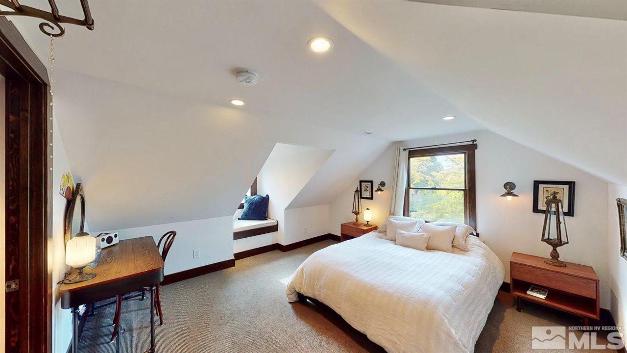 1300 Clough Road Reno, NV 89509 - Photo 23 of 40 a bedroom with a bed and wooden floor