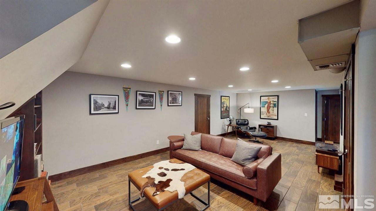 1300 Clough Road Reno, NV 89509 - Photo 29 of 40 a living room with furniture and a wooden floor