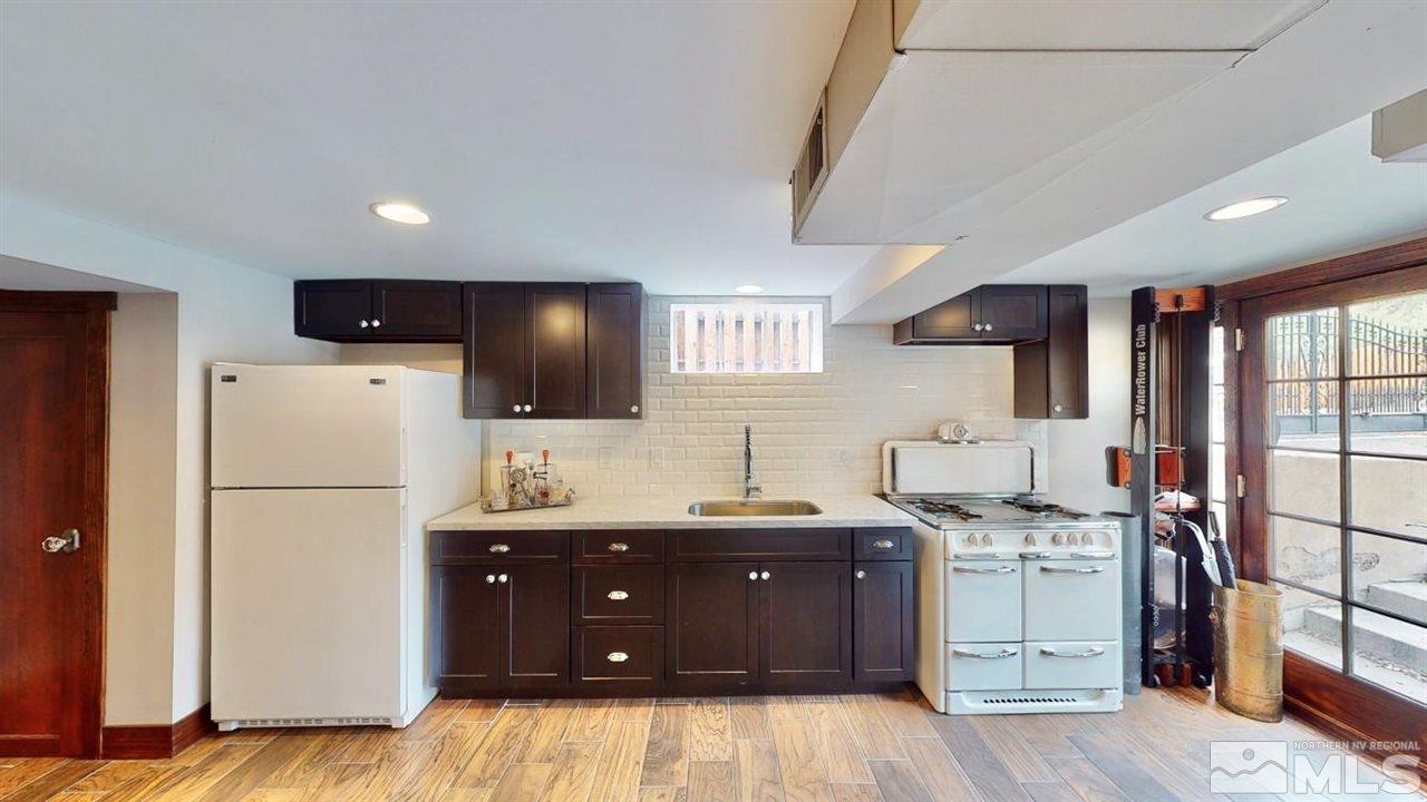 1300 Clough Road Reno, NV 89509 - Photo 31 of 40 a kitchen with a sink appliances and cabinets