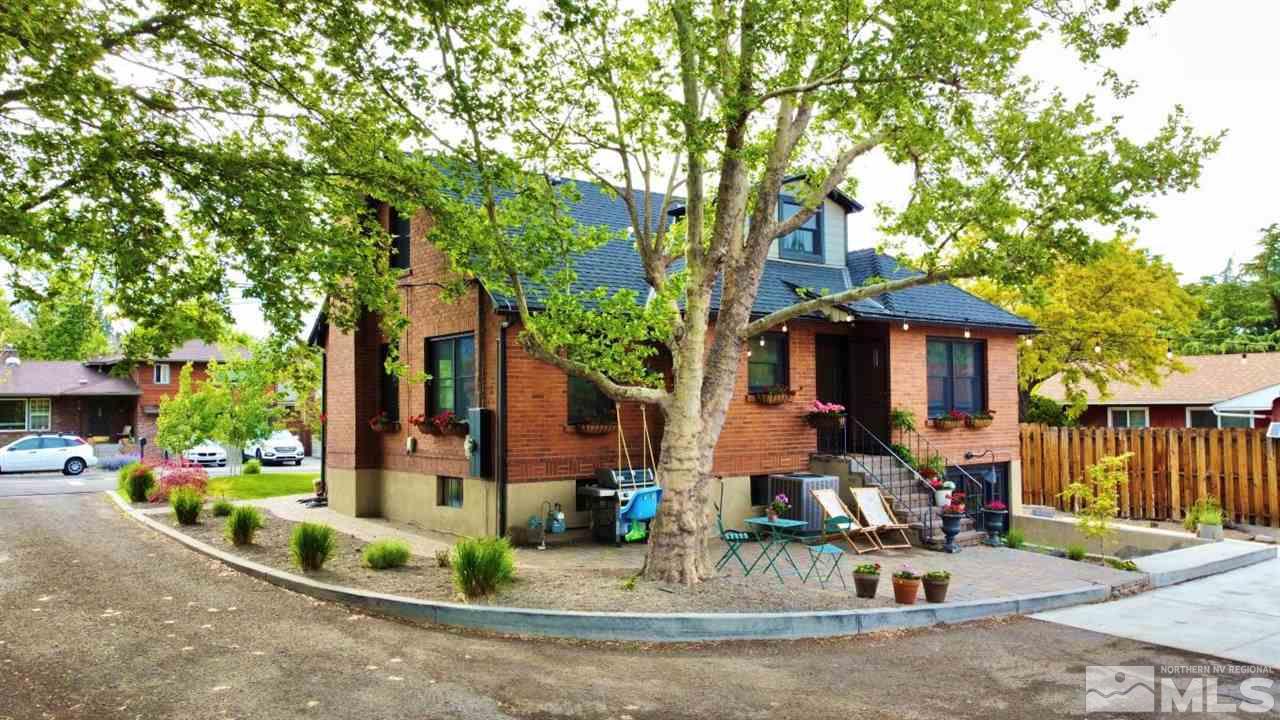 1300 Clough Road Reno, NV 89509 - Photo 39 of 40 a view of a house with a small yard and potted plants