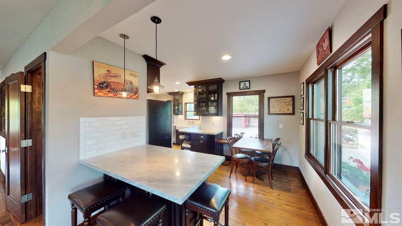 1300 Clough Road Reno, NV 89509 - Photo 6 of 40 a view of a dining room with furniture window and wooden floor
