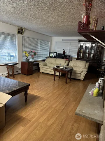 a living room with furniture and a rug