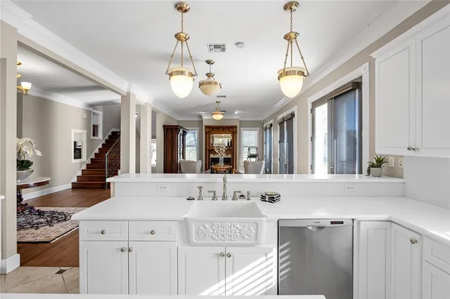 a view of a center island and chandelier